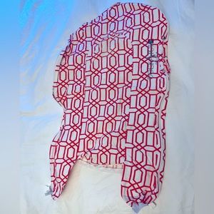 DockATot Deluxe+ Cover with an orange geometric design